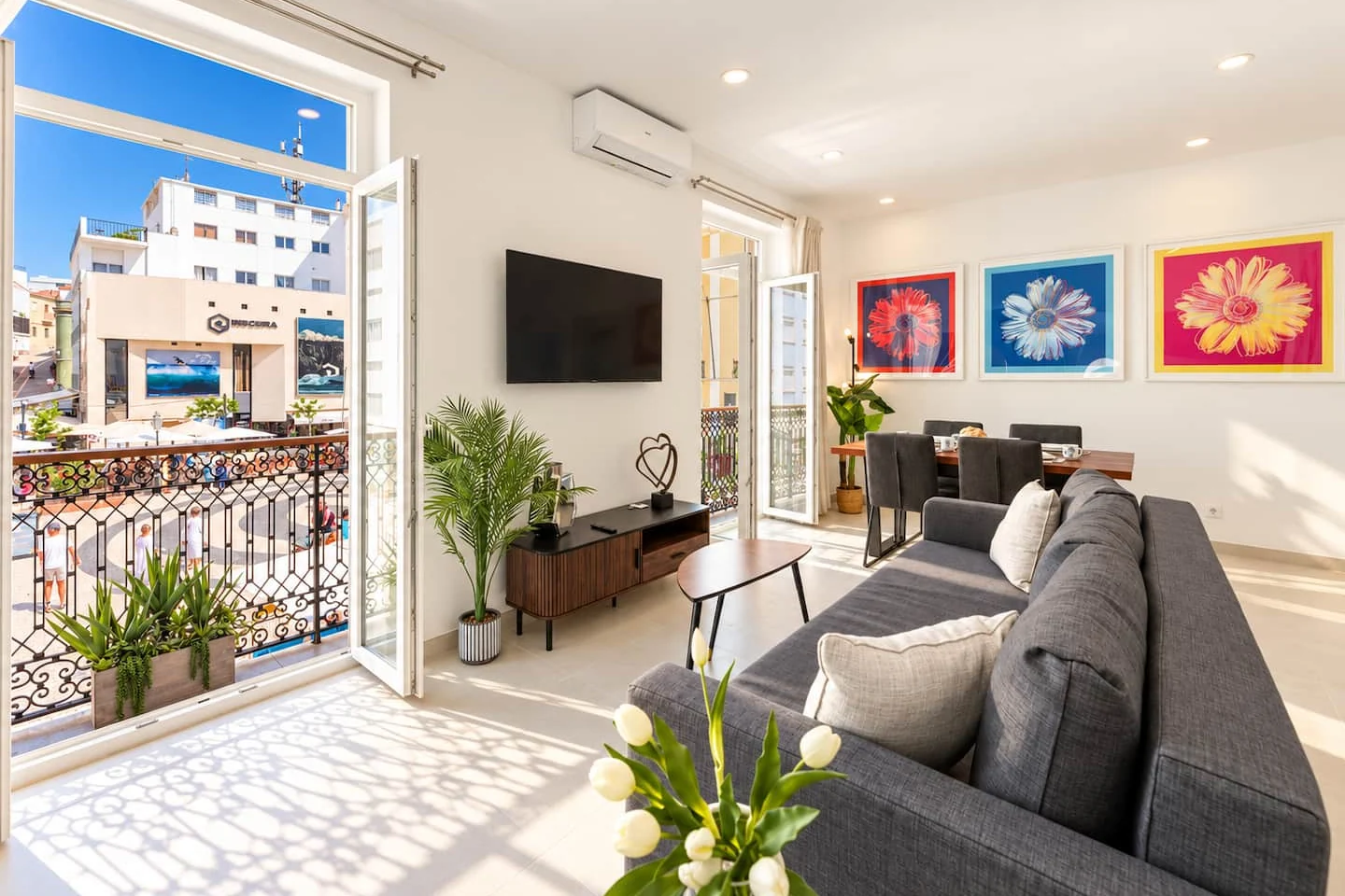 Grey sofa and French doors overlooking Praça Gil Eanes at 18th Century Gem